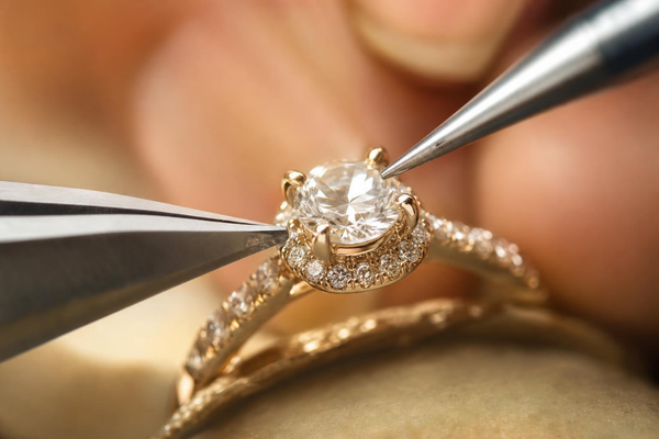 Diamond ring undergoing professional stone tightening