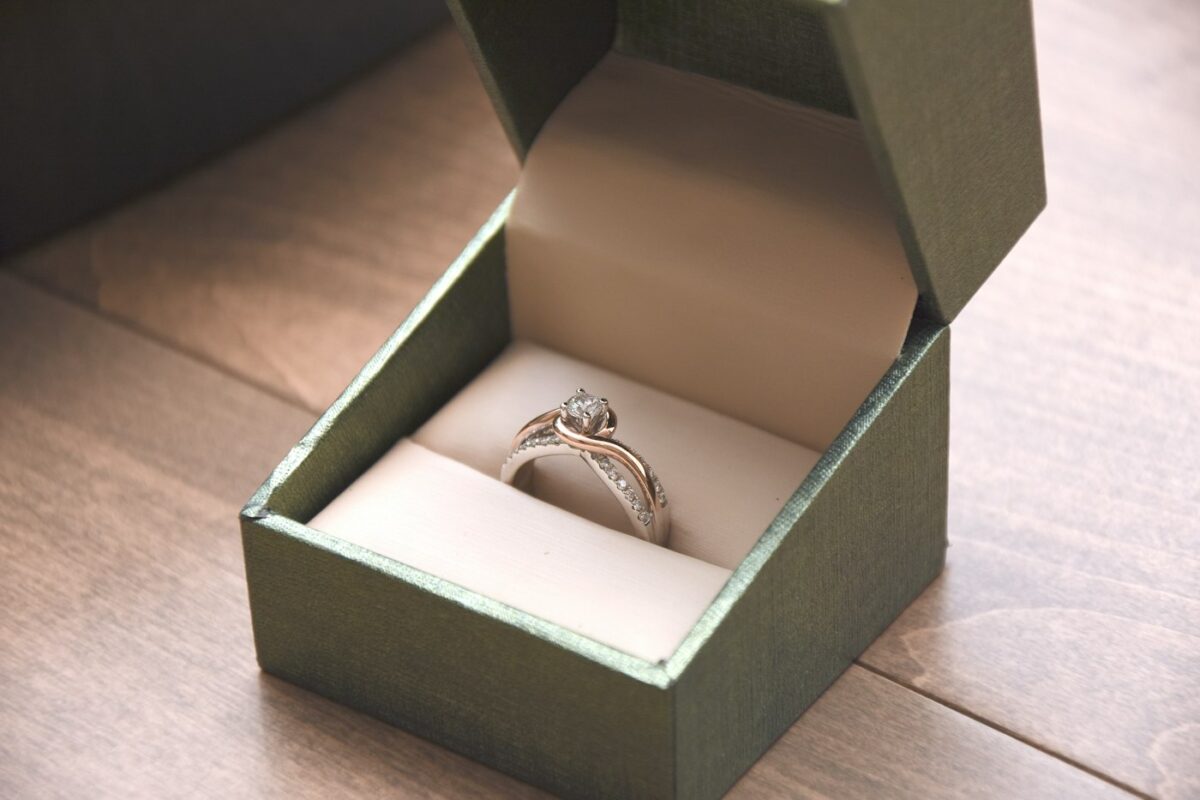 Engagement ring with a center stone in a ring box